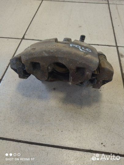 Суппорт тормозной передний левый Volkswagen Polo