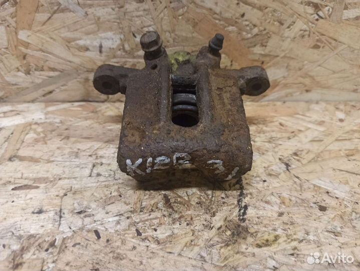 Суппорт задний левый Toyota Corolla E 120