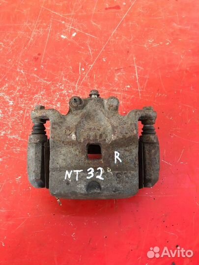 Суппорт тормозной передний правый Nissan Teana J32