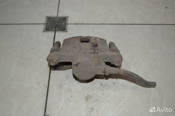 Тормозной суппорт задний левый Mitsubishi Lancer 9