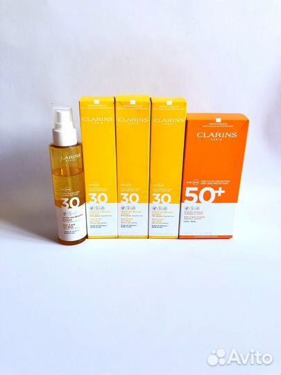 Крем для загара Clarins, Lancaster, Garnier