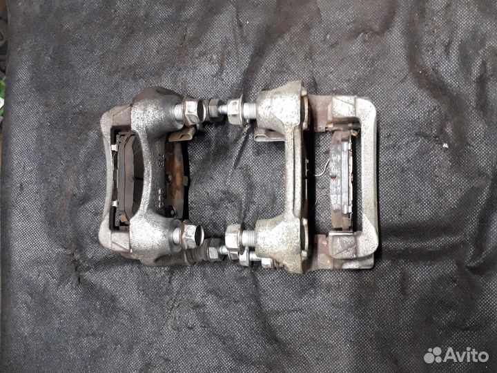 Скоба суппорта заднего Toyota Corolla E210