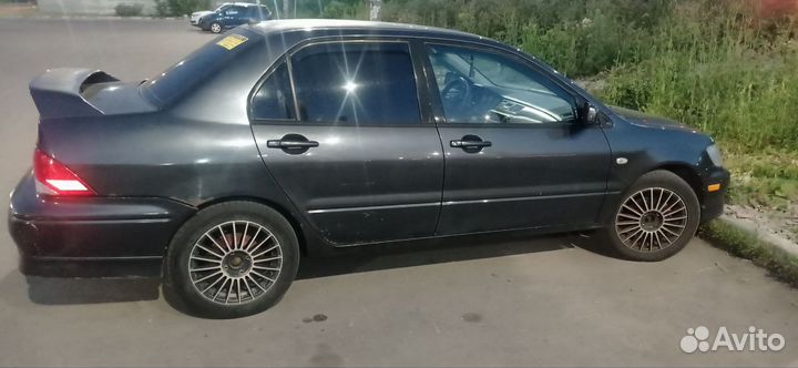 Mitsubishi Lancer 2.0 МТ, 2002, 200 386 км