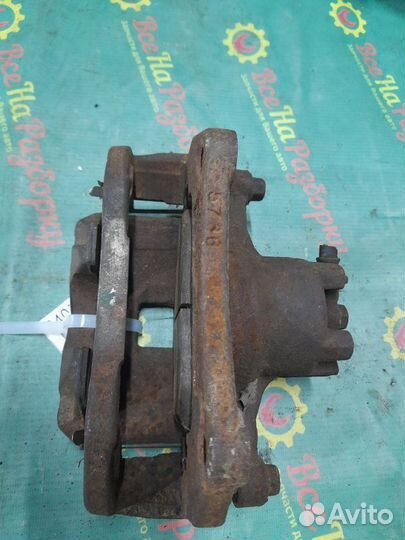 Суппорт передний левый Mitsubishi Lancer 10 седан