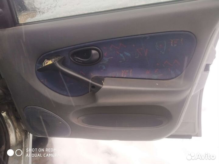 Обшивка двери Fiat Palio