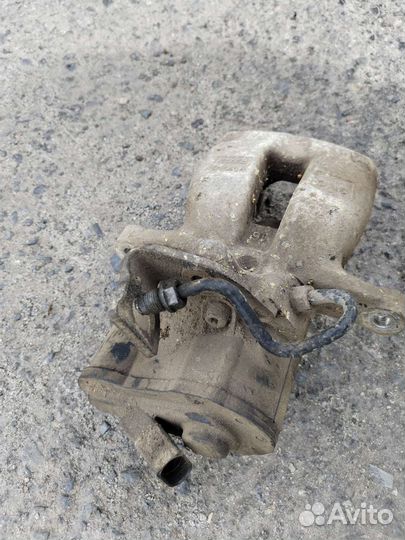 Суппорт тормозной задний левый