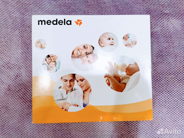 Молокоотсос medela электрический