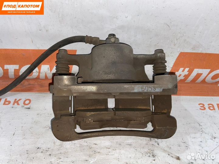 Суппорт тормозной передний левый Nissan X-Trail