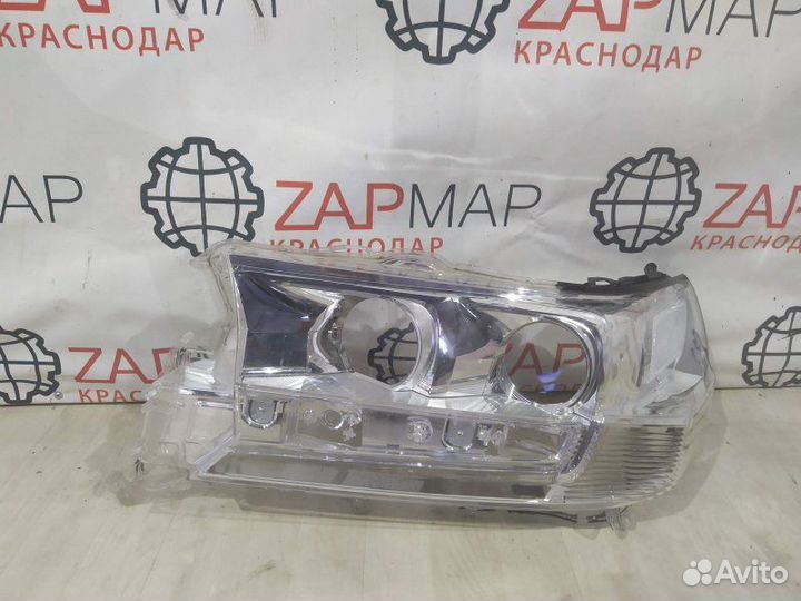 Стекло фары левое Toyota Land Cruiser J200