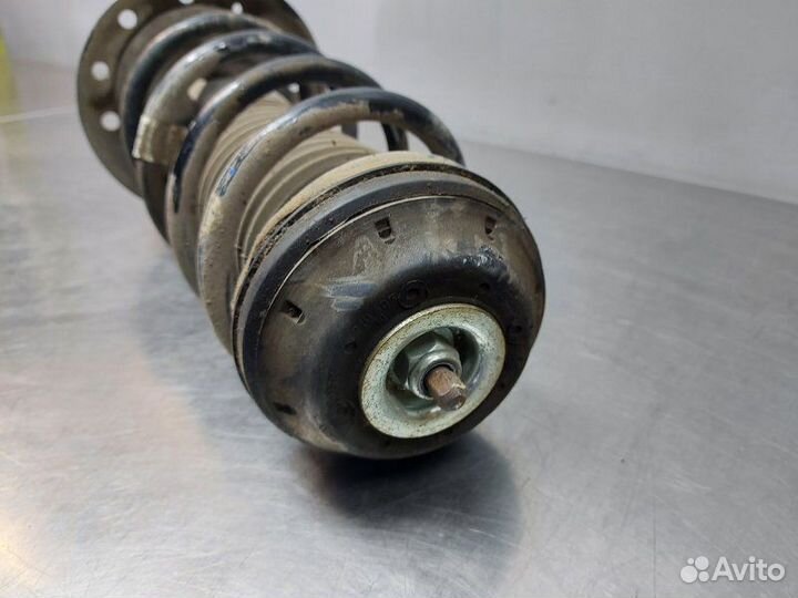 Стойка амортизатора передняя левая Opel Corsa D