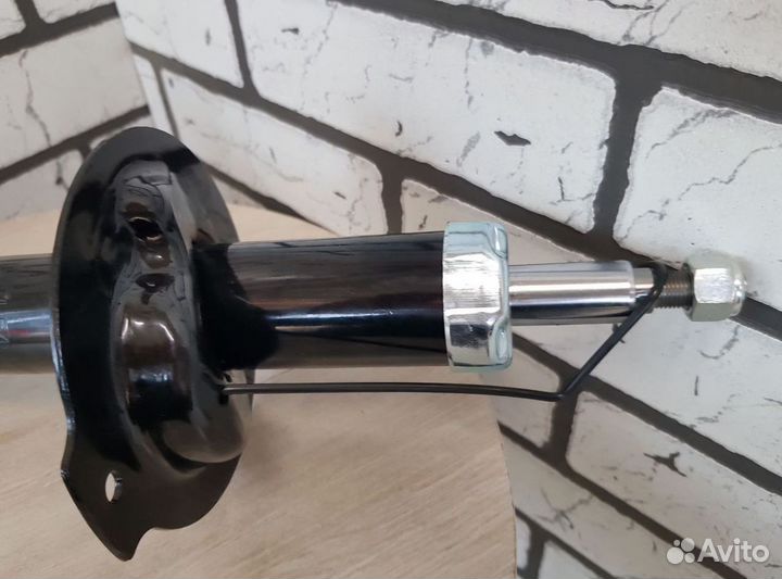 Амортизатор с ABS шевроле перед. левый оригинал