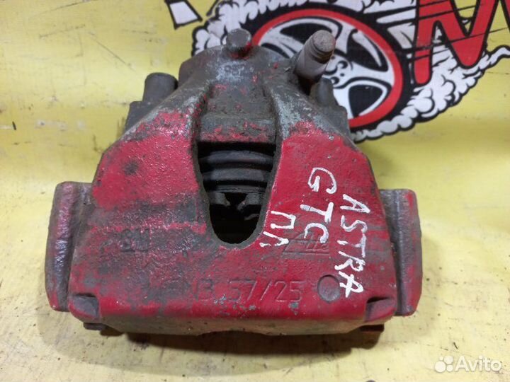 Суппорт тормозной передний левый Opel Astra H GTC