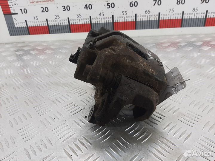 Суппорт передний левый Nissan Navara D22 рест