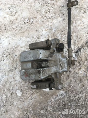 Суппорт тормозной левый задний Toyota Camry кузов