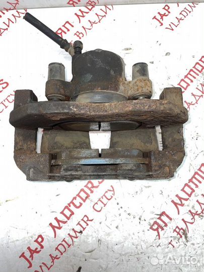 Суппорт тормозной передний левый Mazda 3 BL седан