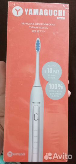 Электрическая зубная щетка