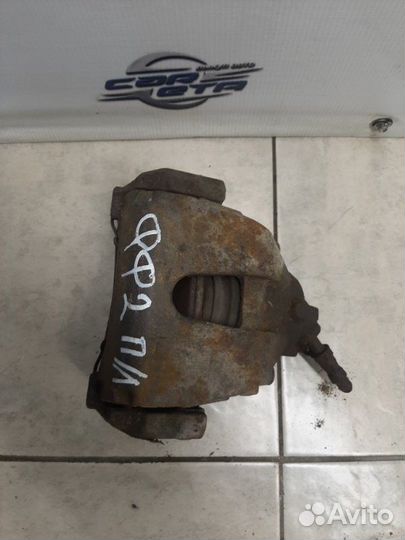 Суппорт тормозной передний левый Ford Focus седан