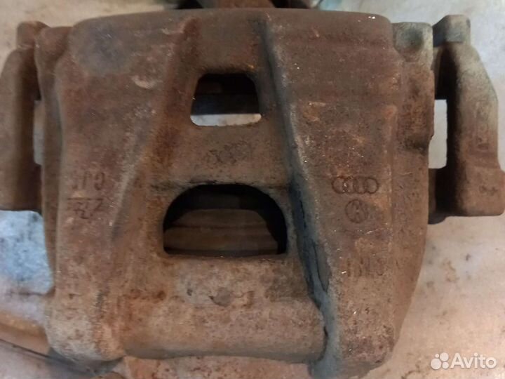 Суппорт тормозной передний VW Tiguan 1