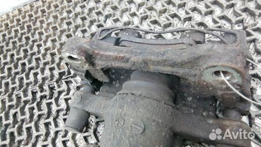 Суппорт тормозной задний левый nissan primera P12