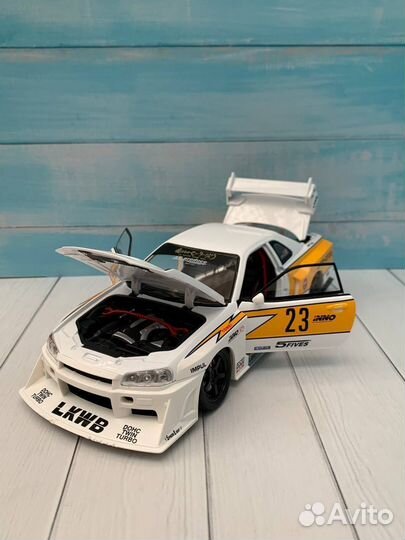 Модель авто Nissan Skyline GT-R R34 lbwk 1:24