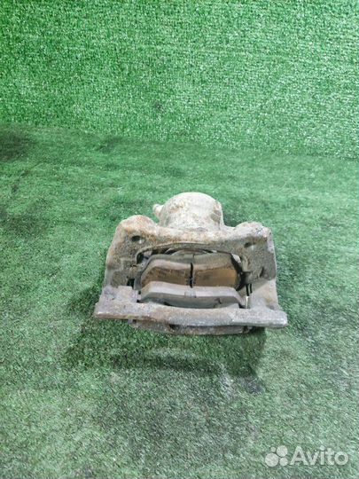 Суппорт тормозной передний левый Nissan Almera G15