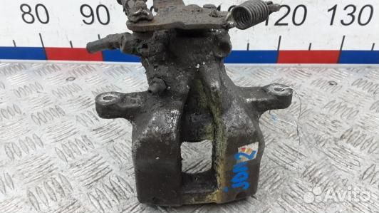 Суппорт тормозной задний левый toyota avensis T27