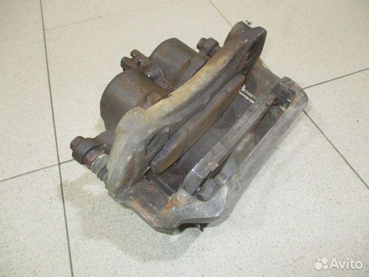 Суппорт передний правый Nissan Navara (D40)