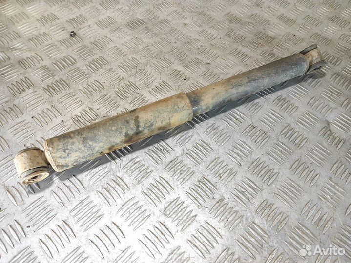 Амортизатор задний левый Mitsubishi L200 2006-2016