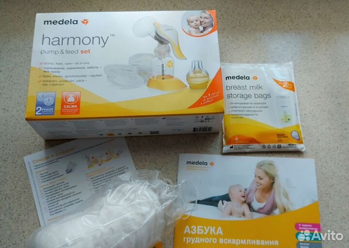 Молокоотсос ручной Medela с вкладышами