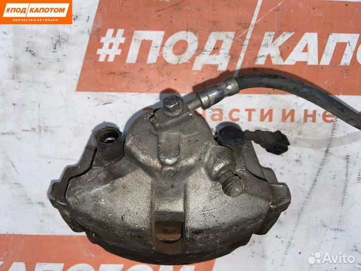 Суппорт тормозной передний левый Volkswagen Caddy