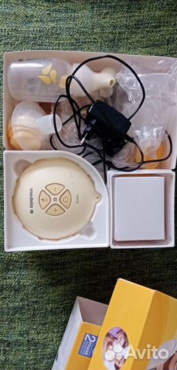 Молокоотсос medela электрический