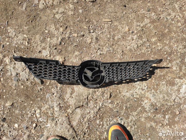 Решетка радиатора Mazda Demio DY