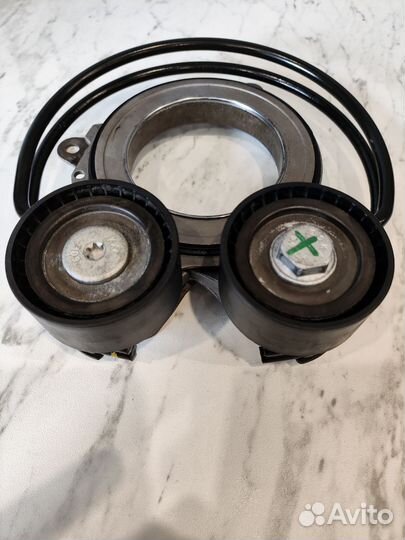 Натяжитель ремня 06N903133