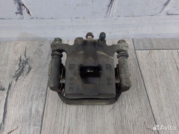 Суппорт тормозной задний правый Tiida Juke Qashqai