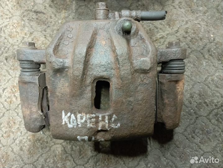 Суппорт передний на Киа Каренс 2004 год