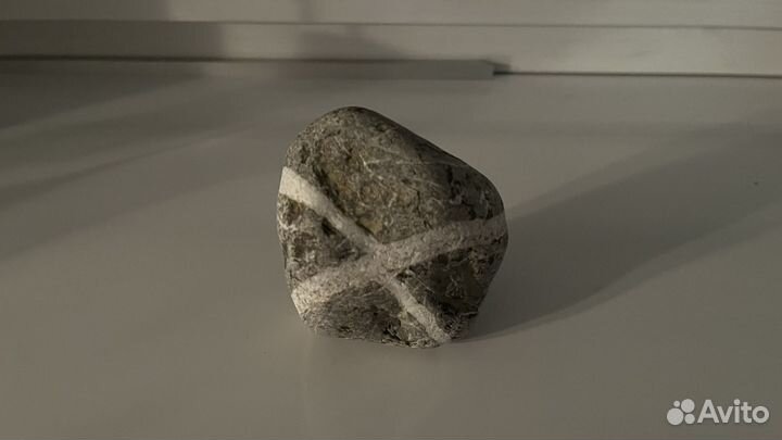 Камень с символом 