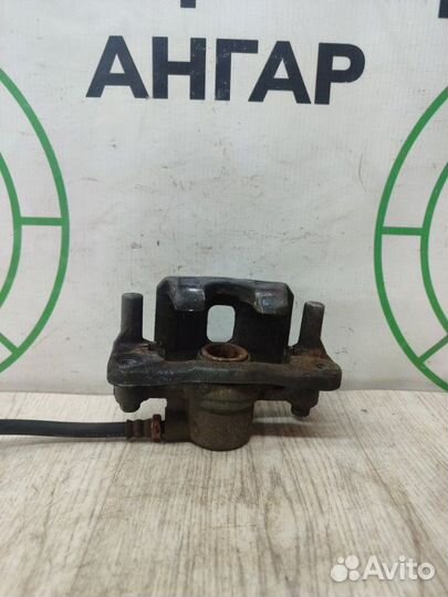 Суппорт тормозной задний левый Mitsubishi Lancer 9