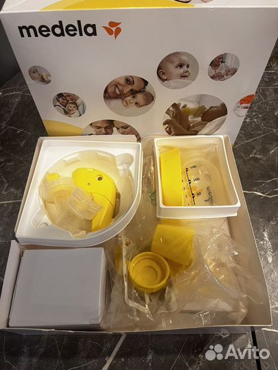 Молокоотсос medela электрический