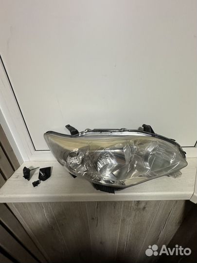 Фара левая для toyota corolla 150