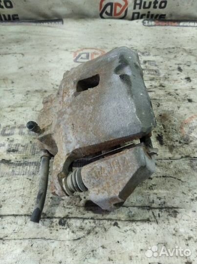 Суппорт тормозной передний левый Mitsubishi Lancer