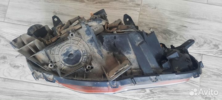 Фара передняя левая lancer 10