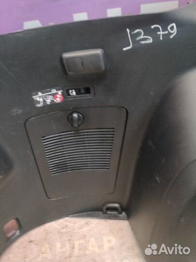 Обшивка багажника левая Mitsubishi Outlander Xl