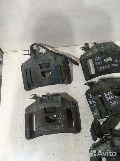 Суппорт тормозной передний левый Ауди А6 С6