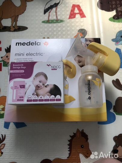 Молокоотсос medela электрический