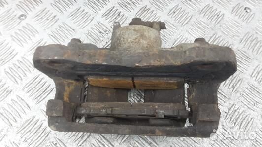 Суппорт тормозной передний левый mitsubishi L200 K