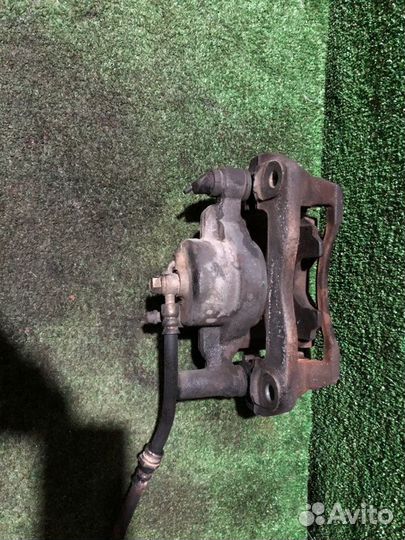 Суппорт тормозной передний левый Mazda Premacy