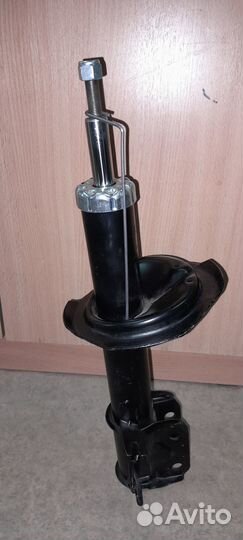 Амортизатор передний левый Suzuki SX4(2006-2012г.в