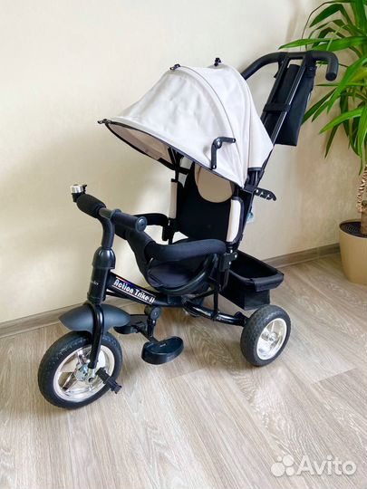Трехколесный велосипед с ручкой коляска