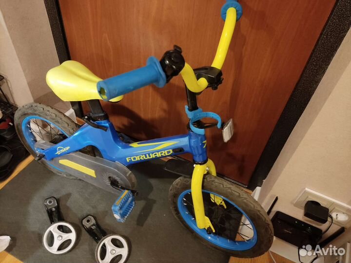 Четырёхколёсный детский велосипед