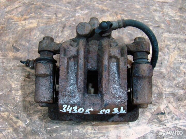 KIA Sportage 2 Суппорт тормозной задний левый